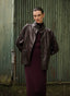 Woman wearing an aubergine jacket from the Japan TKY fall/ winter 2024 collection